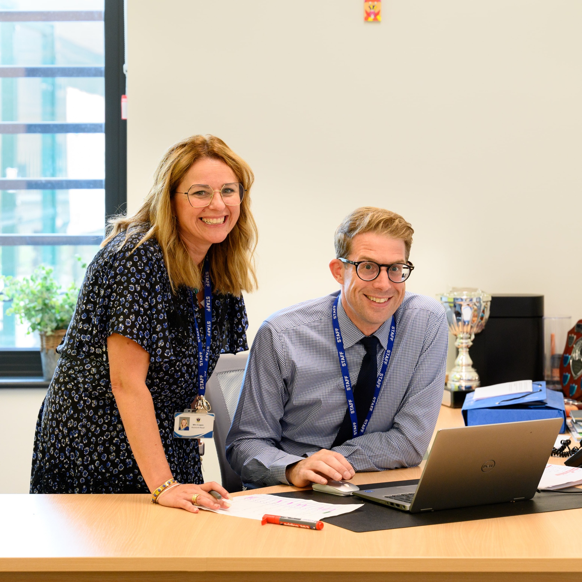 Two senior leaders in a school office 